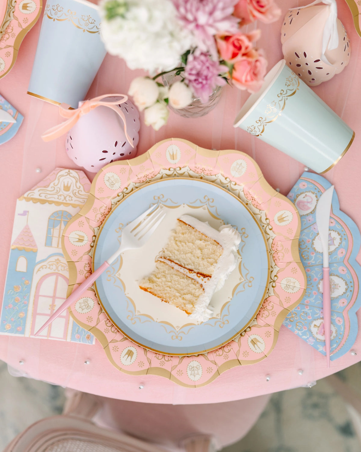 Parisian Princess plate styled on a pink table with a slice of cake