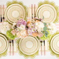 pastel floral plates arranged on table with spring decor.