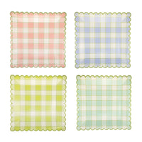 Four square paper plates in pink, blue, yellow, and green pastel plaid patterns with green scalloped edges for an Easter brunch.
