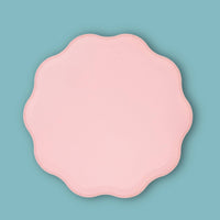 Single pink pastel paper plate with a wavy scalloped edge
