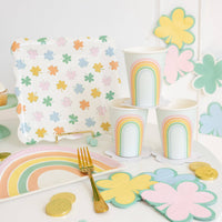 Pastel shamrock cocktail napkins styled on a St. Patrick’s Day party table with rainbow cups and plates