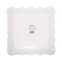 Back view of pastel shamrock paper plate showing scalloped edges