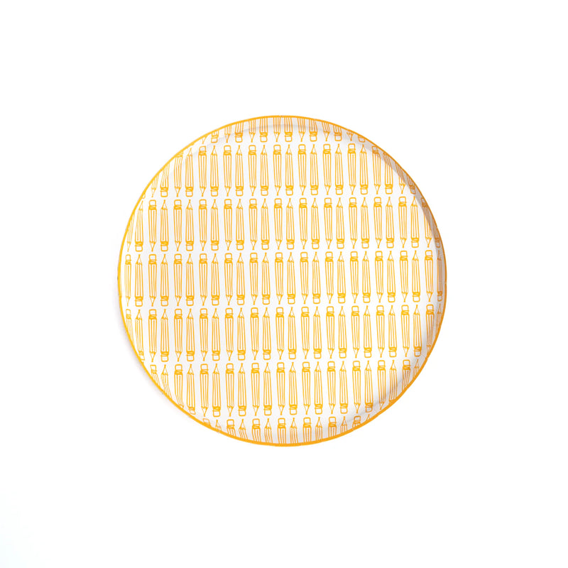 Close‑up product photo of yellow pencil dinner plate isolated on white.