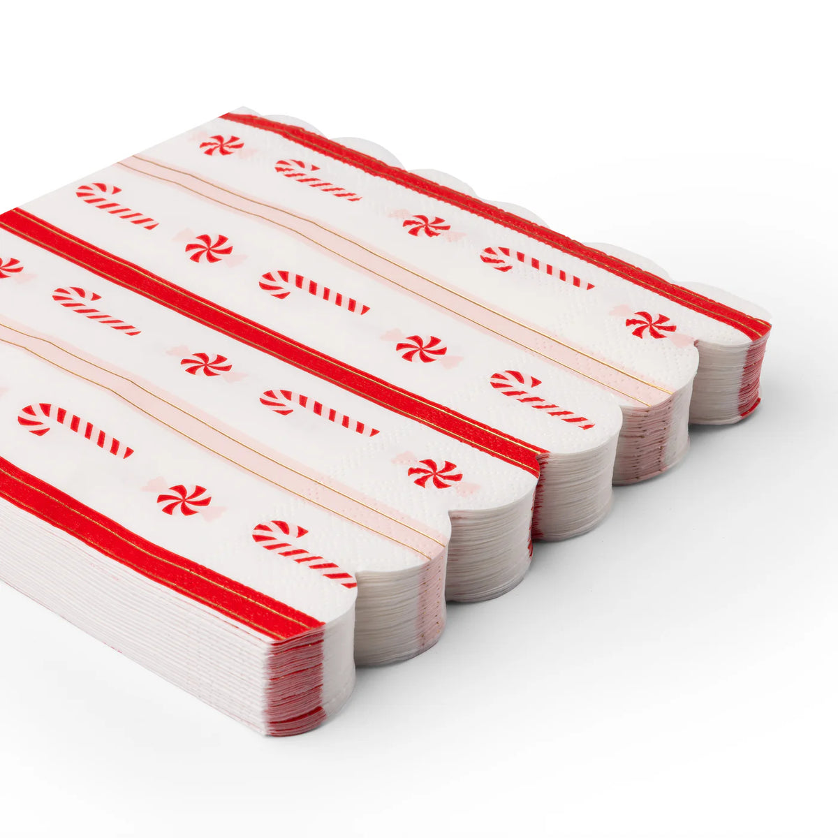 Stacked scalloped napkins showing red candy cane and peppermint pattern—perfect for candy cane Christmas decor.