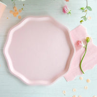 Single petal pink compostable dinner plate on table with matching cup and napkin—ideal girl baby shower plates.