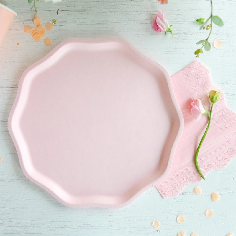 Single petal pink compostable dinner plate on table with matching cup and napkin—ideal girl baby shower plates.