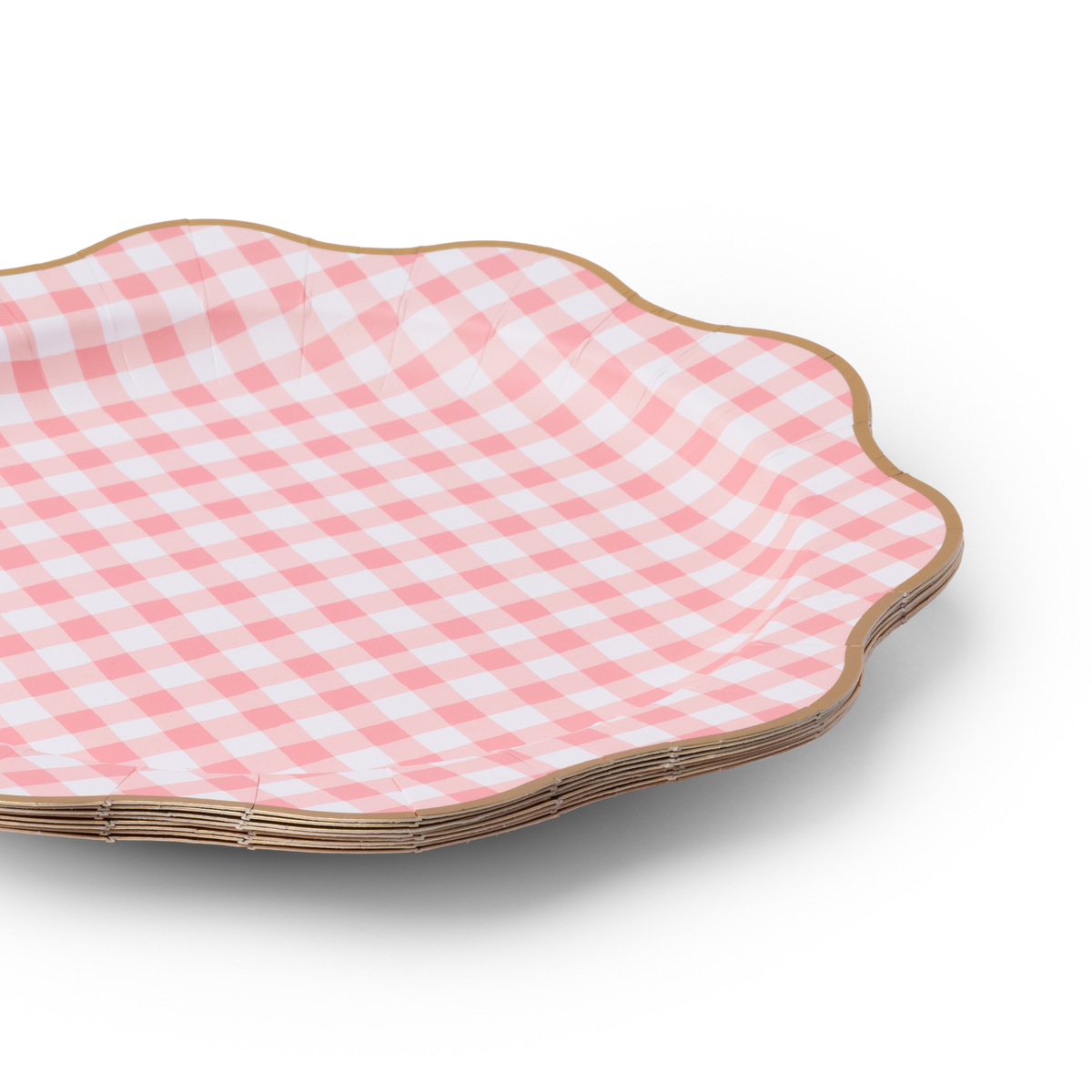Stack of petal pink gingham dinner plates with gold foil edges
