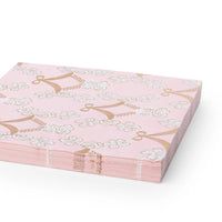 Petal pink Rococo napkins shown folded and stacked at an angle