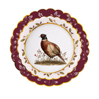 Pheasant plate stacked on a mulberry-wreath plate and a burgundy berry-vine scalloped charger.