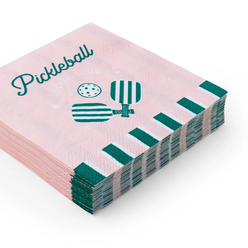 Stack of pink pickleball cocktail paper napkins with teal paddles—cute pickleball party decorations.