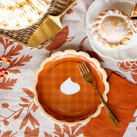 Pie dessert plate on a fall dessert table with forks and mini pies.