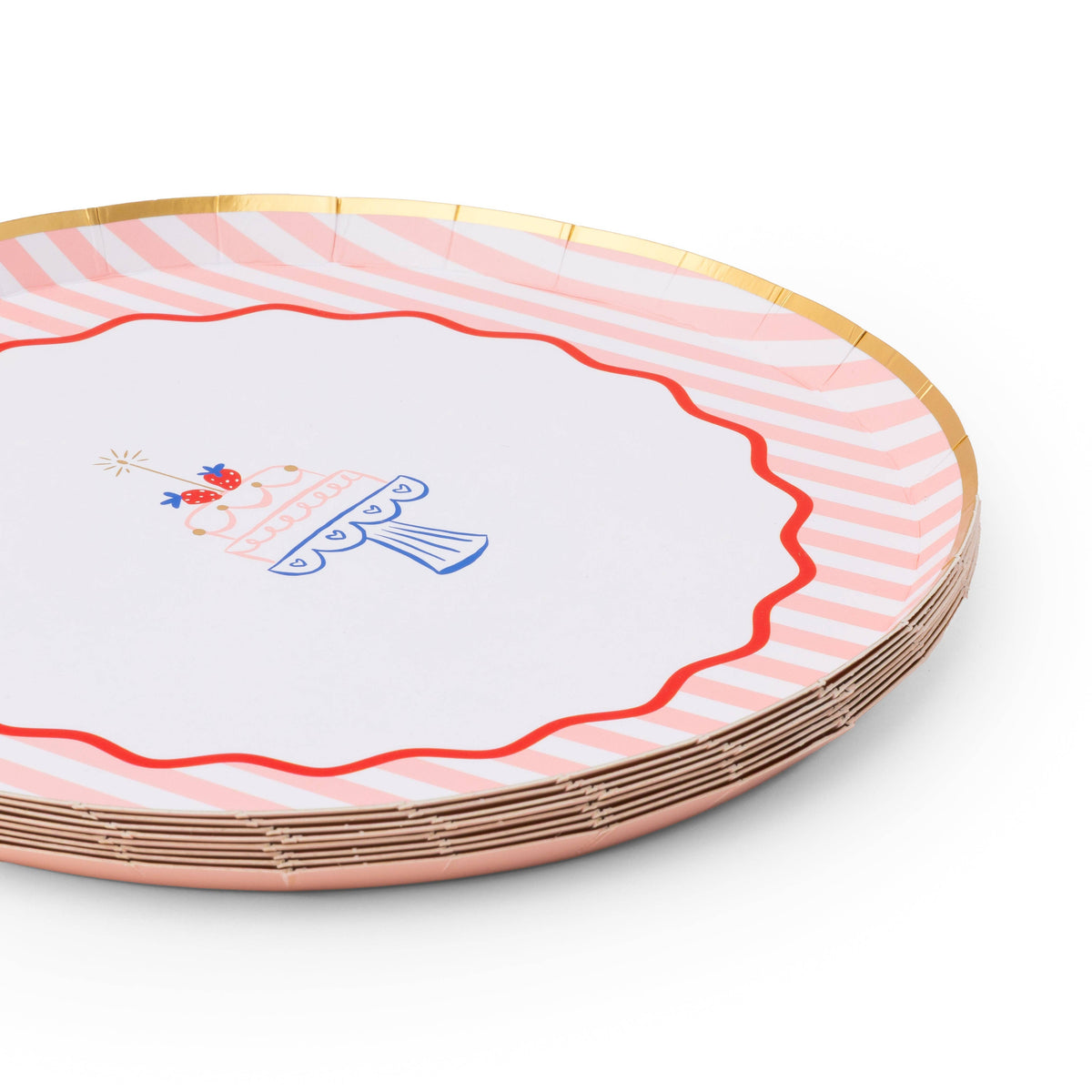 Angled stack of pink striped birthday cake paper plates with red scalloped wavy border and gold foil rim on white background