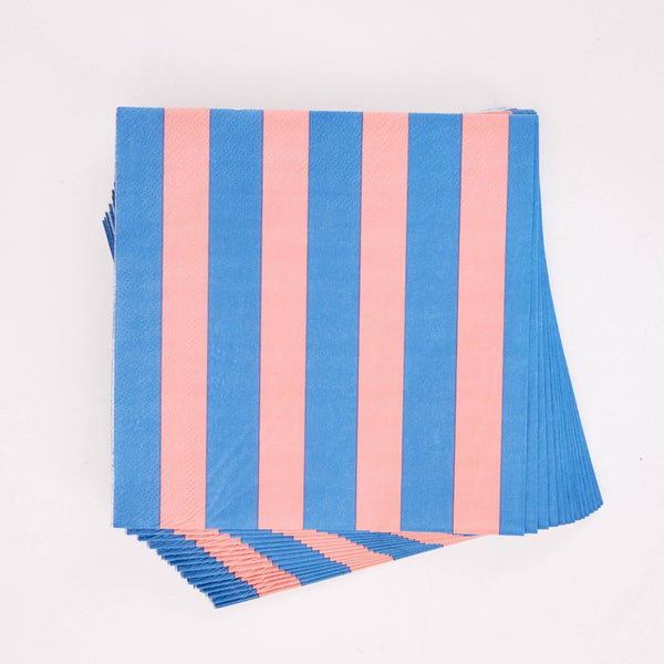 Close-up of overlapping pink and blue striped paper lunch napkins