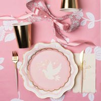 Pink bow dinner plate with gold utensils and floral details for baptism