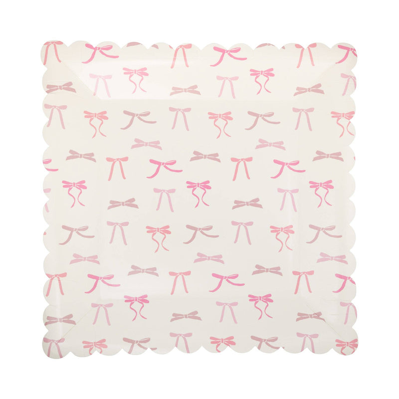 Top-down view of Pink Bow Print Square Paper Plate showing the full all-over pink ribbon bow pattern with bows in varying shades of pink scattered across cream surface, framed by a scalloped square edge