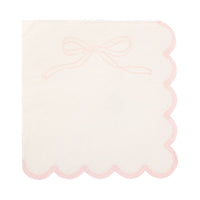 Single cream Pink Bow Scalloped Paper Cocktail Napkin unfolded on white background showing cream surface with pink ribbon bow line drawing in upper left corner and pink scalloped edges on all sides