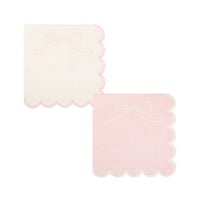 Both Pink Bow Scalloped Paper Cocktail Napkin designs displayed side by side on white background — cream napkin with pink bow + pink scalloped edge, pink napkin with white bow + white scalloped edge