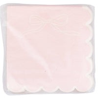Front view of unopened Pink Bow Scalloped Paper Cocktail Napkins package showing the pink napkin design with white ribbon bow line drawing in upper corner and white scalloped edge
