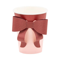 Pink and burgundy paper cup with 3D bow on the front