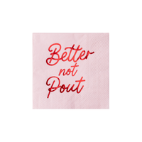 Soft-pink Christmas cocktail napkin with "Better Not Pout" in red script lettering, front view on white background.