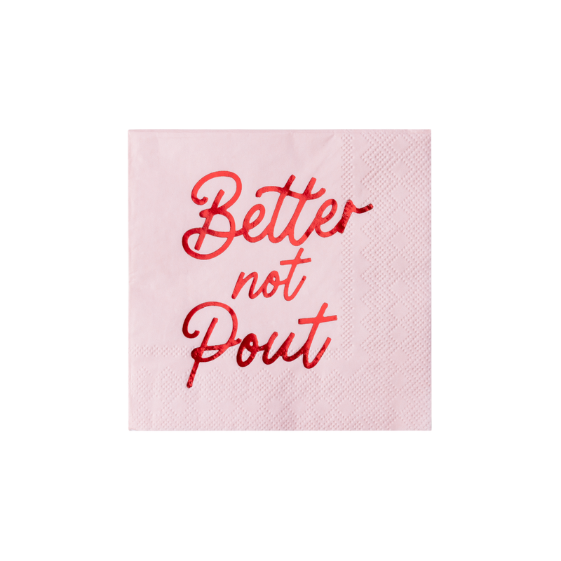 Soft-pink Christmas cocktail napkin with "Better Not Pout" in red script lettering, front view on white background.