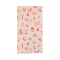 Pink Christmas dinner napkin with a red and pink happy icon pattern and scalloped edges