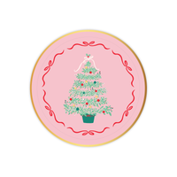 Pink Christmas Tree dessert plate with illustrated green tree and red ribbon border on a pink background.