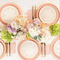 Pink floral napkins styled with plates and spring flowers table setting