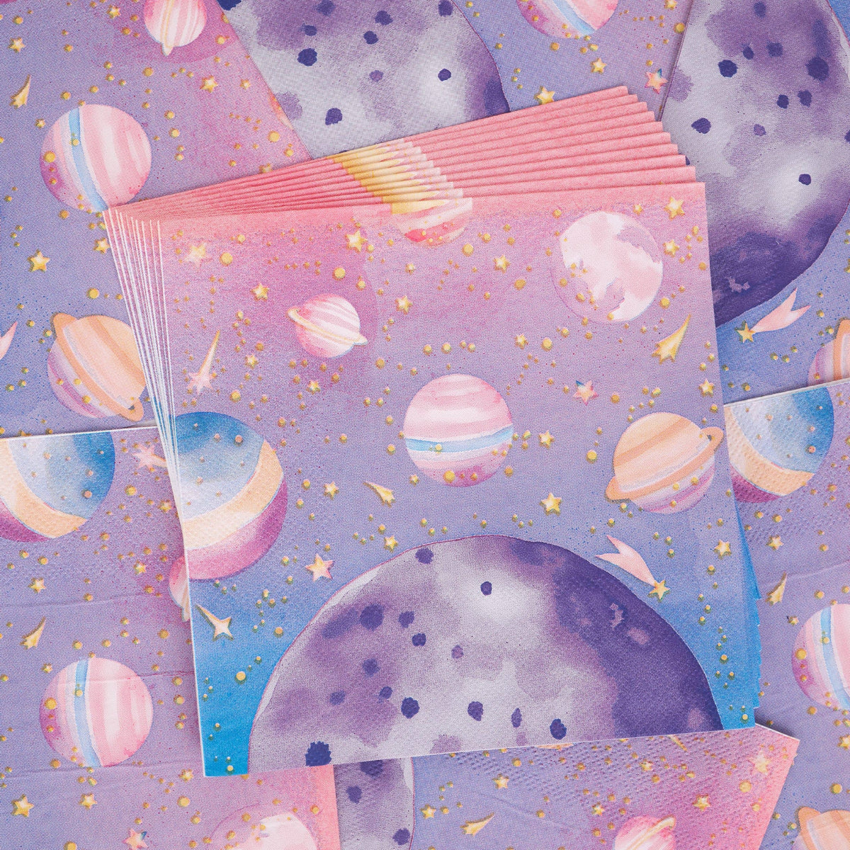 	Fanned stack of pink and purple galaxy paper napkins with gold-foil planets