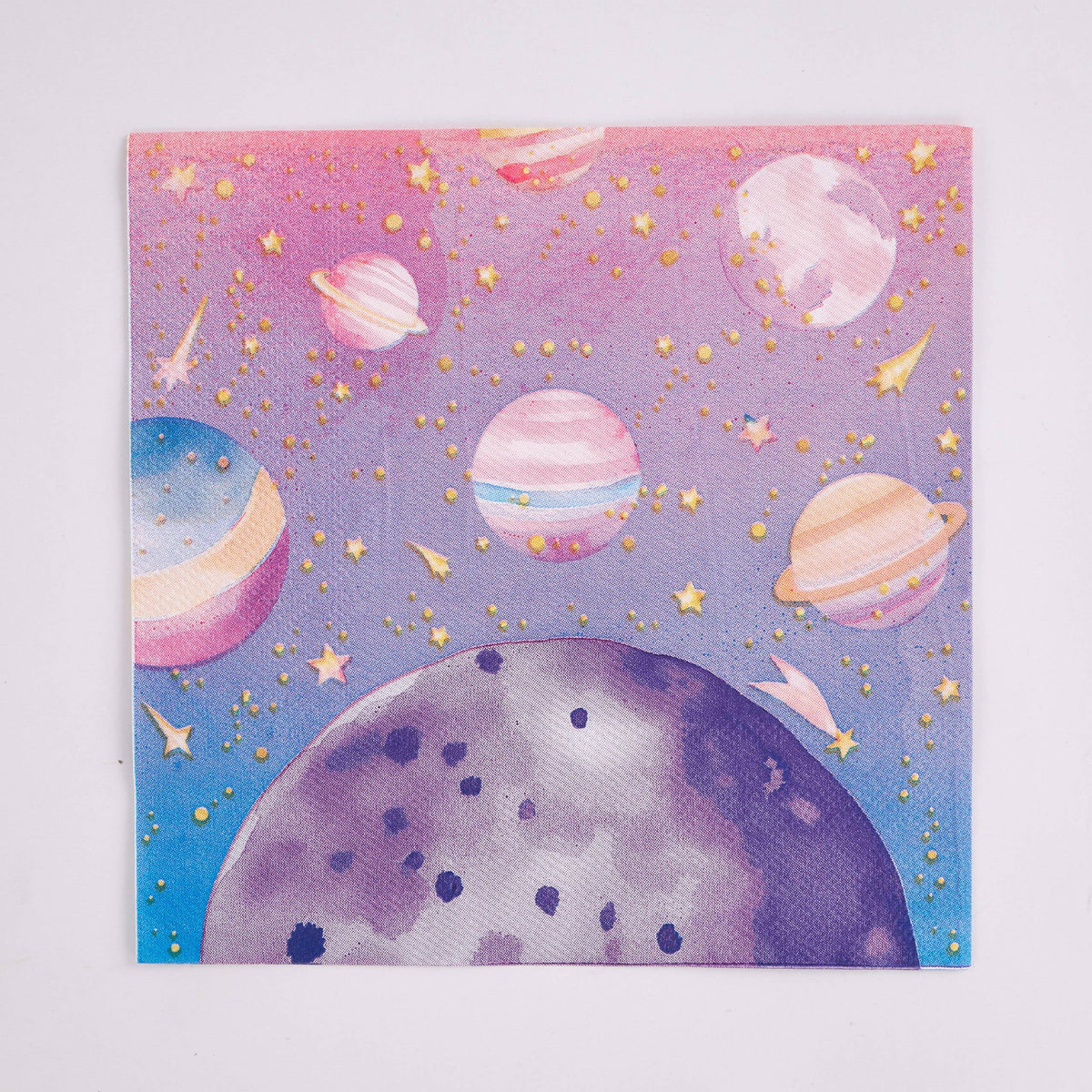 Single pink and purple galaxy paper lunch napkin flat, showing planets, stars and a moon