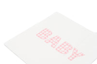 Close crop of the BABY lettering in pink gingham print on a white paper cocktail napkin
