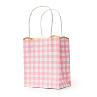 Pink gingham paper favor bag with gold scalloped rim and twisted white handles, standing upright