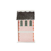 Back view of the pink patisserie house showing three arched windows and the glitter roofline