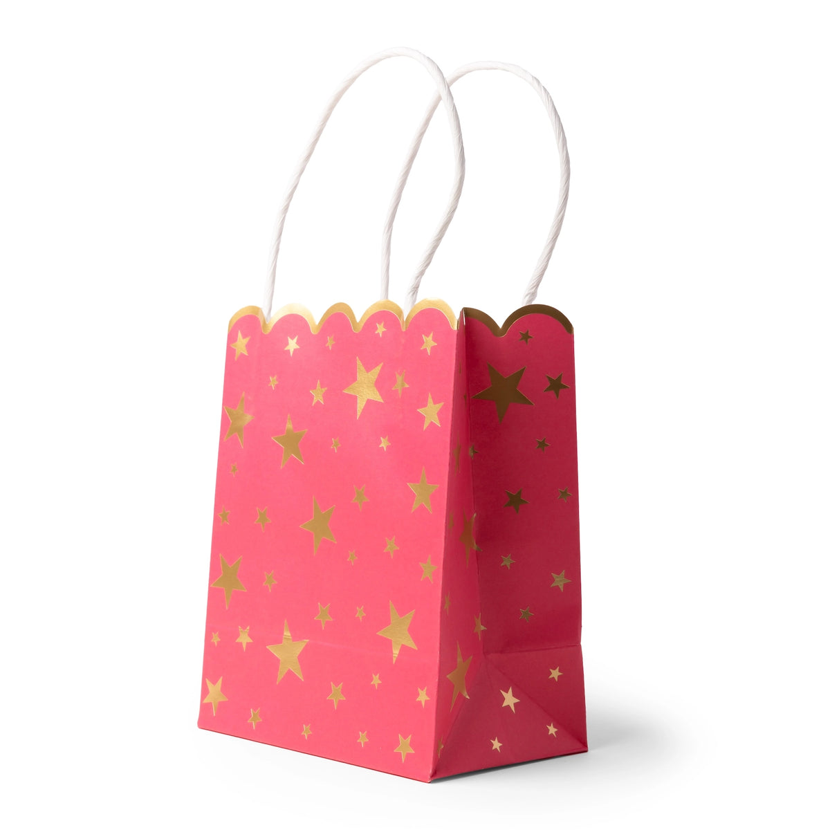 Pink favor bag, three-quarter view, dotted with gold-foil stars and finished with a scalloped top and white handles.