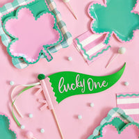 Pink and green St Patrick’s Day shamrock plates on a party table