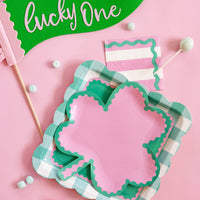 Shamrock shaped party plates in pink and green for festive table settings
