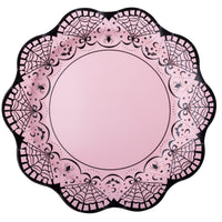 Pink scalloped Halloween plate with a black lace-and-spiderweb border on a white background.