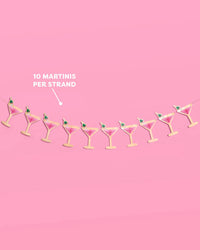 Full 5-foot pink martini glass banner with callout reading "10 martinis per strand"