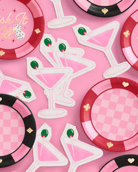 Pink martini napkins styled with red and pink checkered casino plates and "Risk It All" plate flatlay