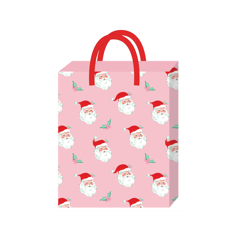 Pink Christmas gift bag with vintage Santa faces, pink holly berries and red rope handles