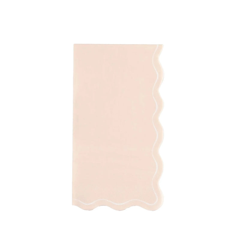 Single blush guest towel with wavy scallop border—powder-room ready.