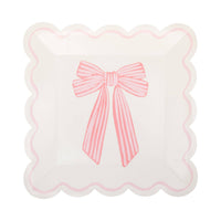 Single cream Pink Striped Bow Square Paper Plate on white background showing cream surface with a large hand-drawn pink-and-white striped ribbon bow centered on the plate, framed by a pink scalloped square edge