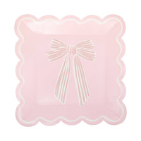 Single pink Pink Striped Bow Square Paper Plate on white background showing pink surface with a large hand-drawn soft pink-on-pink striped ribbon bow centered on the plate, framed by a white scalloped square edge
