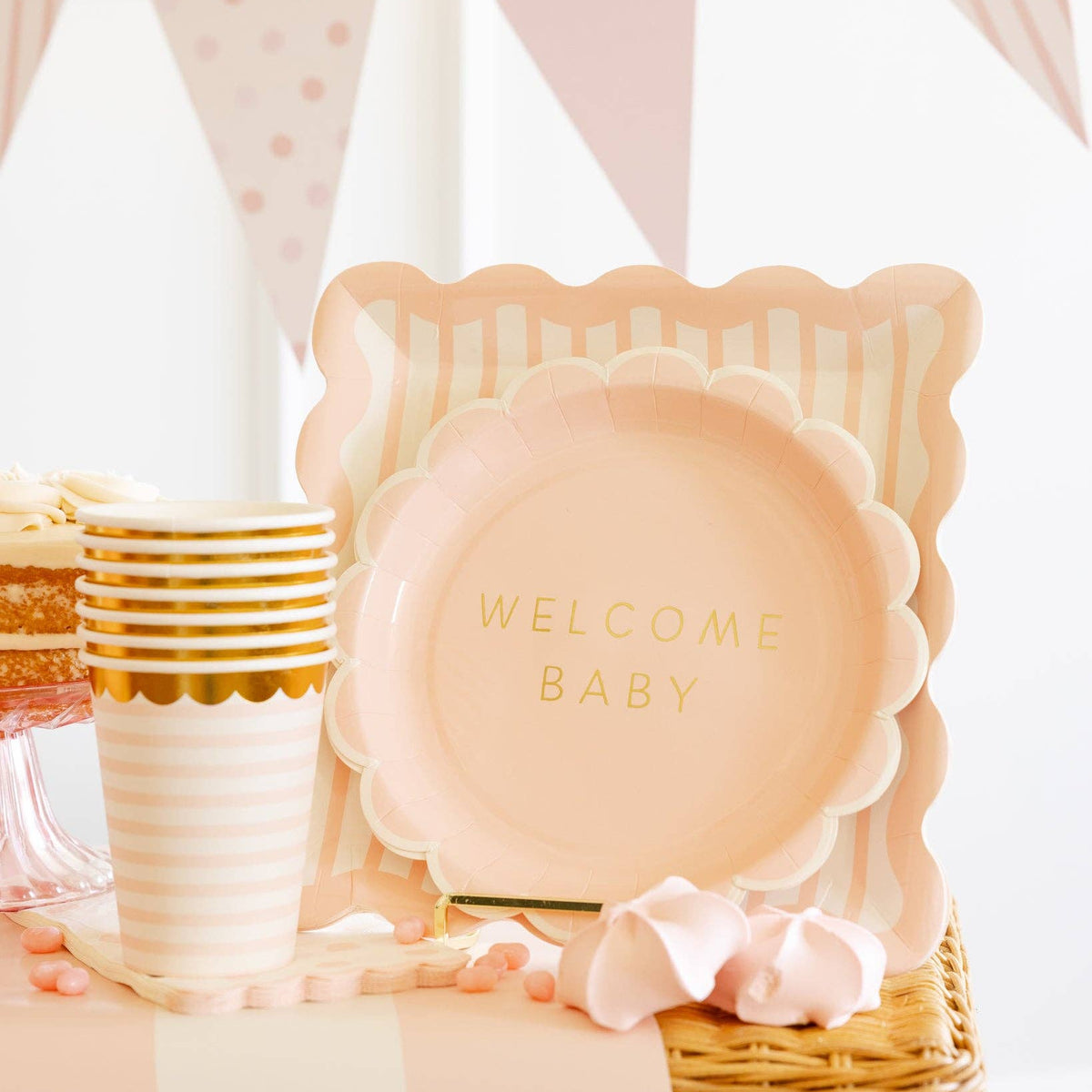 Scalloped square pink plates paired with dessert and cups