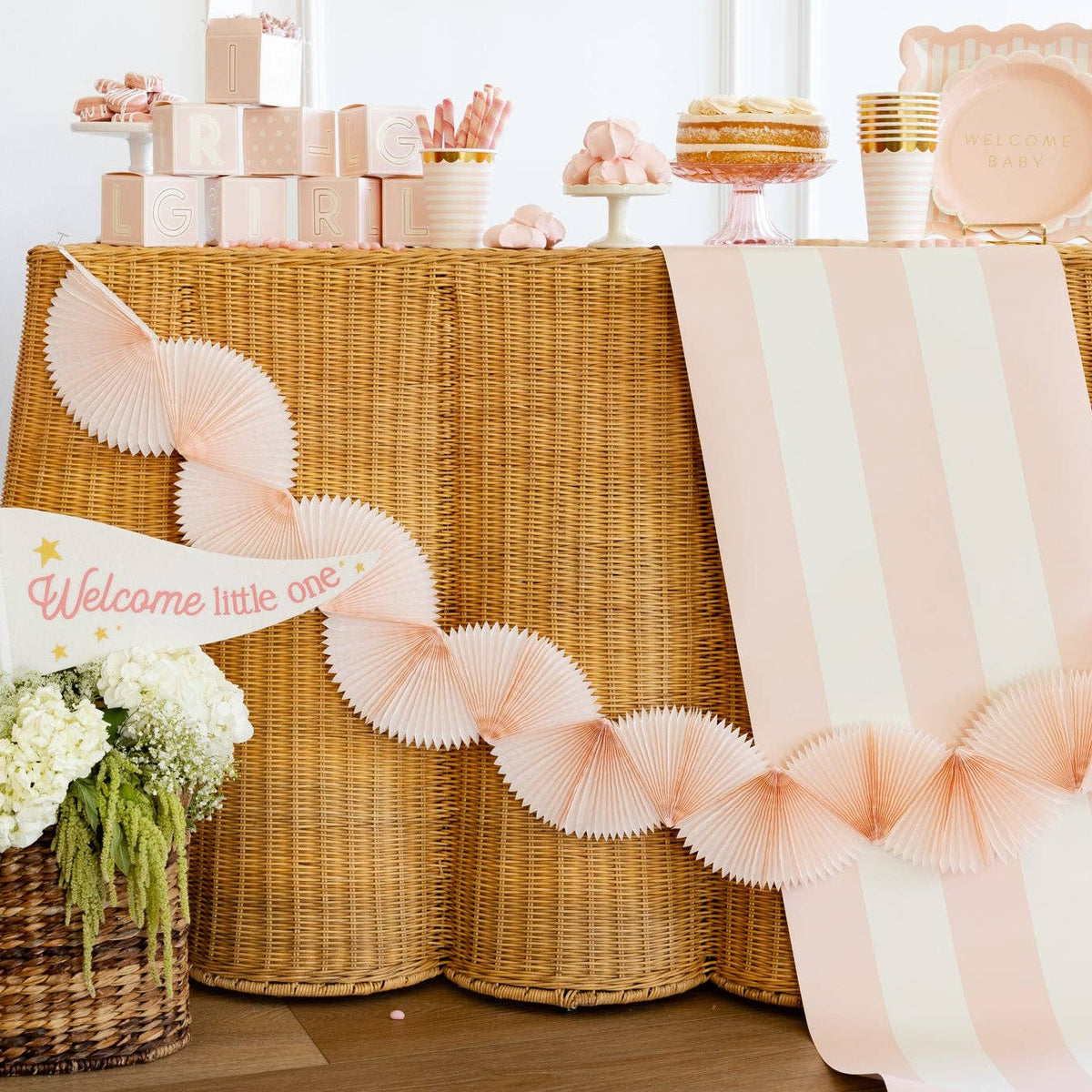  Pink tissue bunting banner styled on baby shower dessert table
