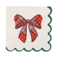 Cream paper cocktail napkin with red tartan plaid bow and green scalloped edge
