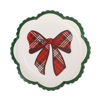 Cream scalloped paper plate with red tartan plaid bow and green wavy edge