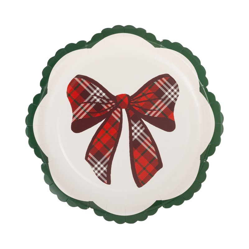 Cream scalloped paper plate with red tartan plaid bow and green wavy edge
