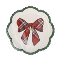Stack of plaid bow scalloped paper plates in clear packaging