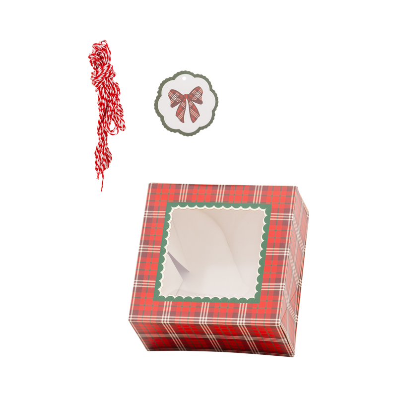 Red tartan plaid cookie box with green scalloped window, bow gift tag, and red and white striped twine